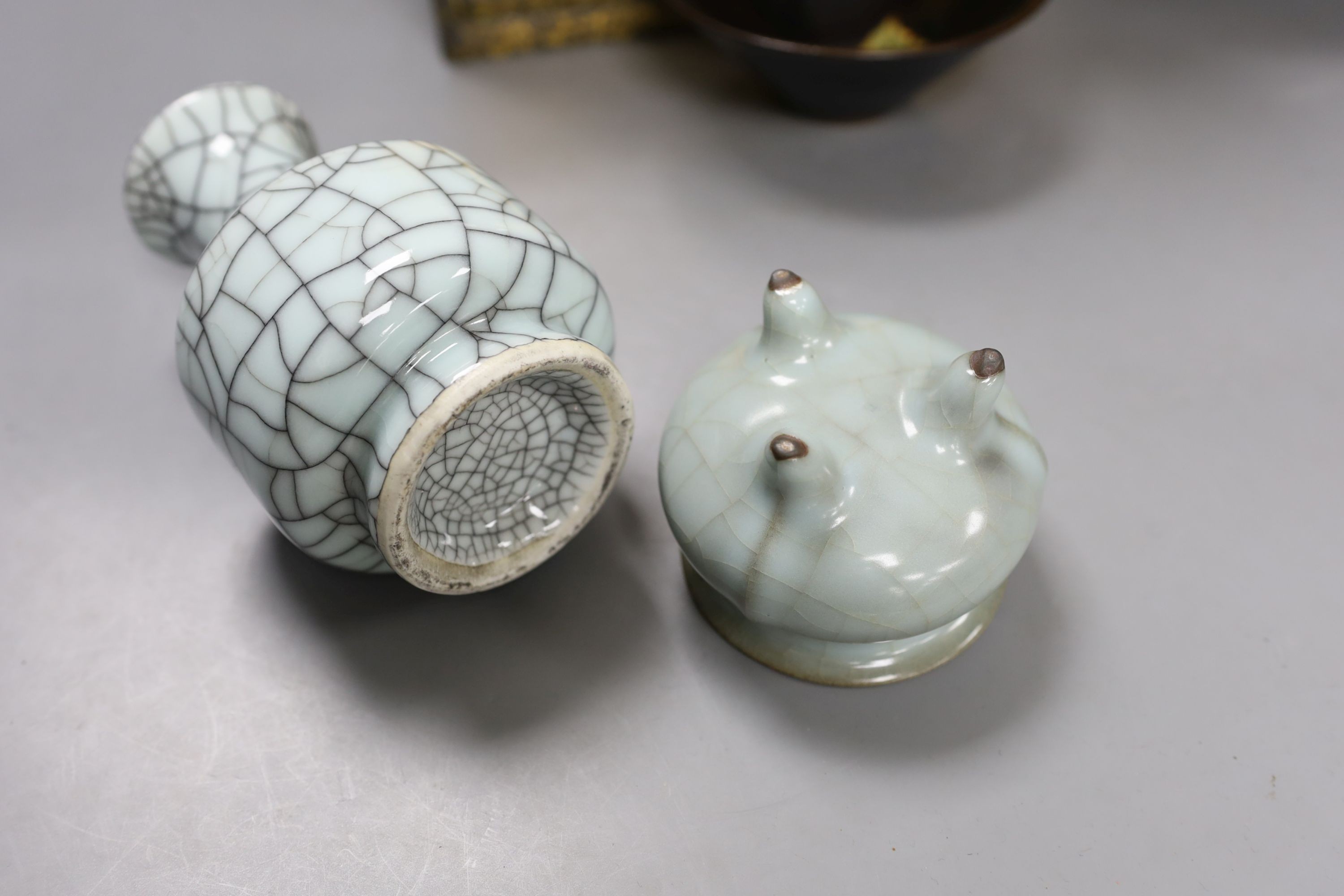 A group of Chinese monochrome ceramics, comprising two crackle glaze vases, tallest 21 cm, one cased, a Jun type dish and tripod censer a leaf impressed bowl and another bowl